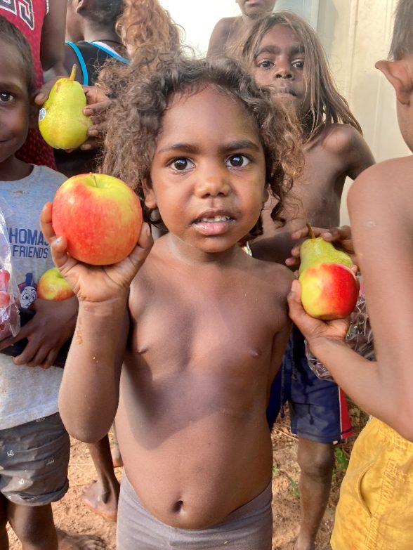 Community kids with fruit